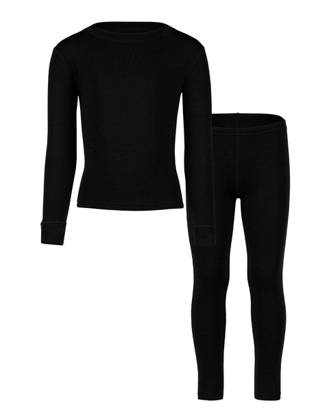 the kids' menique merino 250gsm two piece set of long sleeve top and pants, in black color, white background.