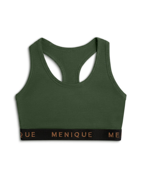 A product shot of a dark green racerback sports bra laid flat against a plain white background. The bra features a wide black elastic underbust band with the brand name "MENIQUE" printed across the front in bronze lettering.