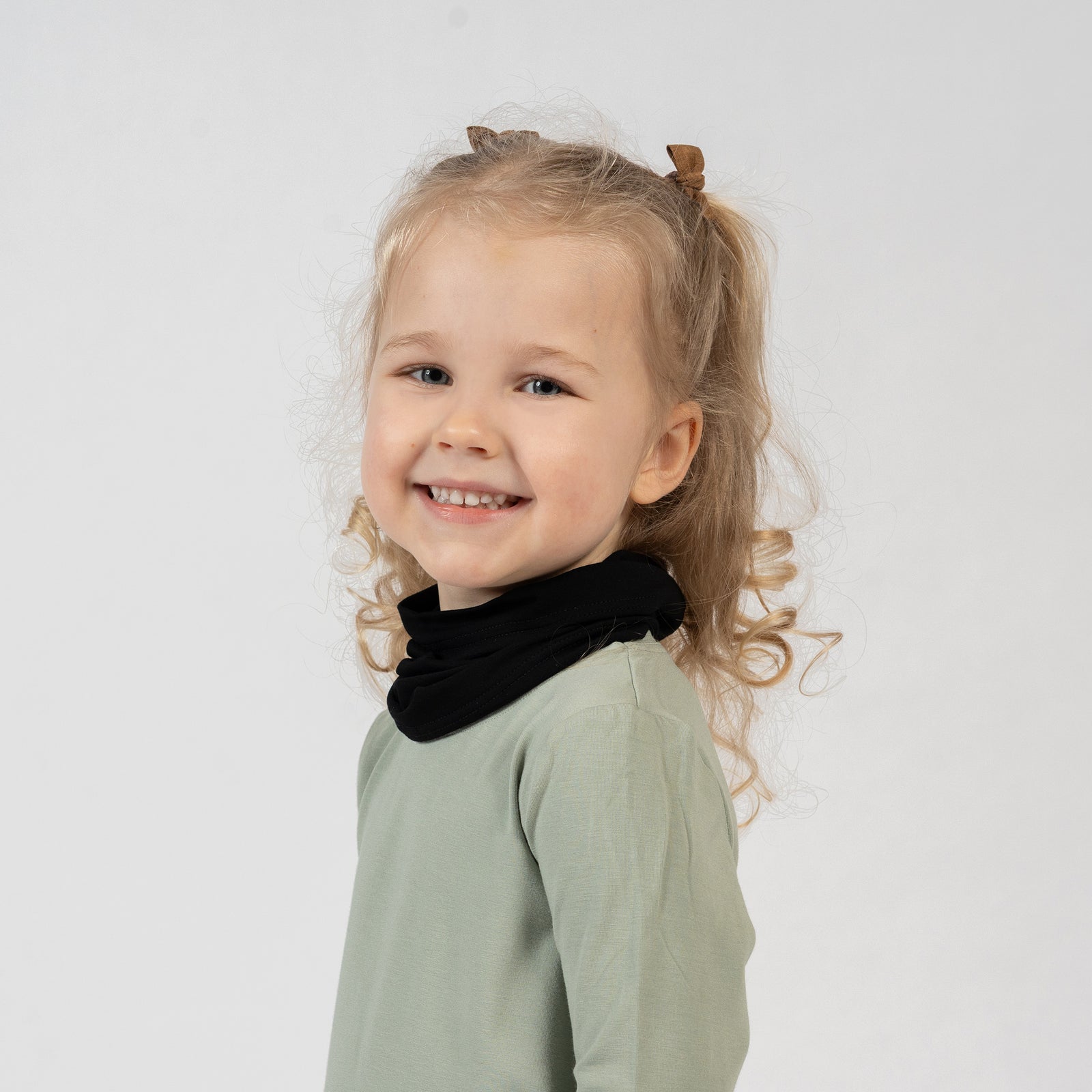 Kids bamboo neck gaiter in black, soft and stretchy scarf for warmth and protection.