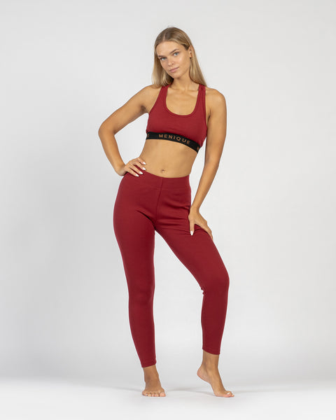The menique women&#39;s merino wool sport bra in 160gsm and leggings in 250gsm fabric, royal cherry color.