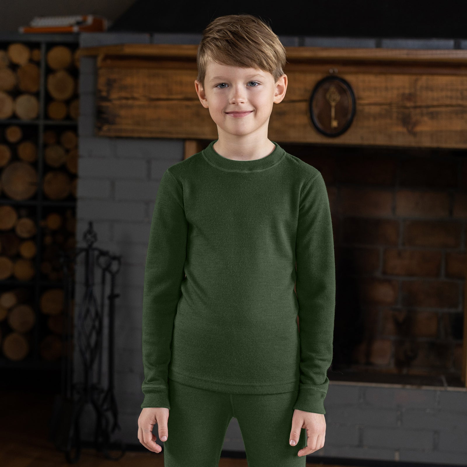 Dark green menique merino long-sleeve shirt and pants set on a white background