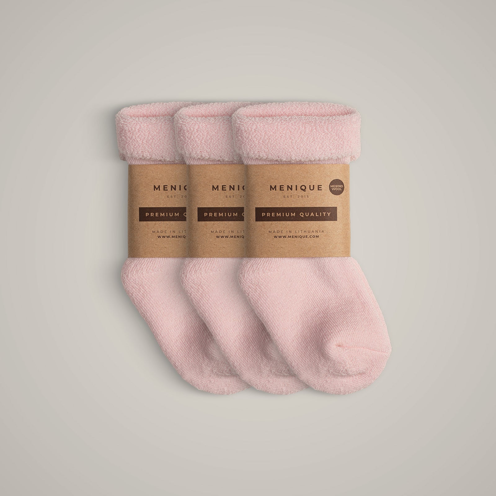 A 3-pack of kids’ light blue sherpa-lined merino wool socks with Menique branding.