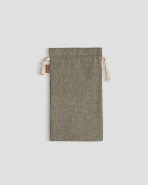 Stone Green drawstring pouch on a light gray background