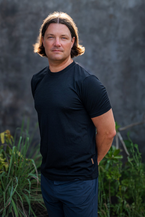 Man wearing regular fit t-shirt from 100% Merino wool in black color