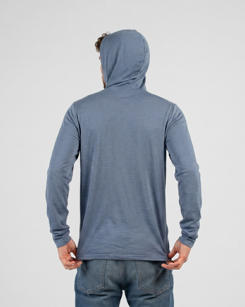 The men’s dusty blue lightweight hooded long sleeve shirt is shown from the back, with a relaxed fit and soft drape.