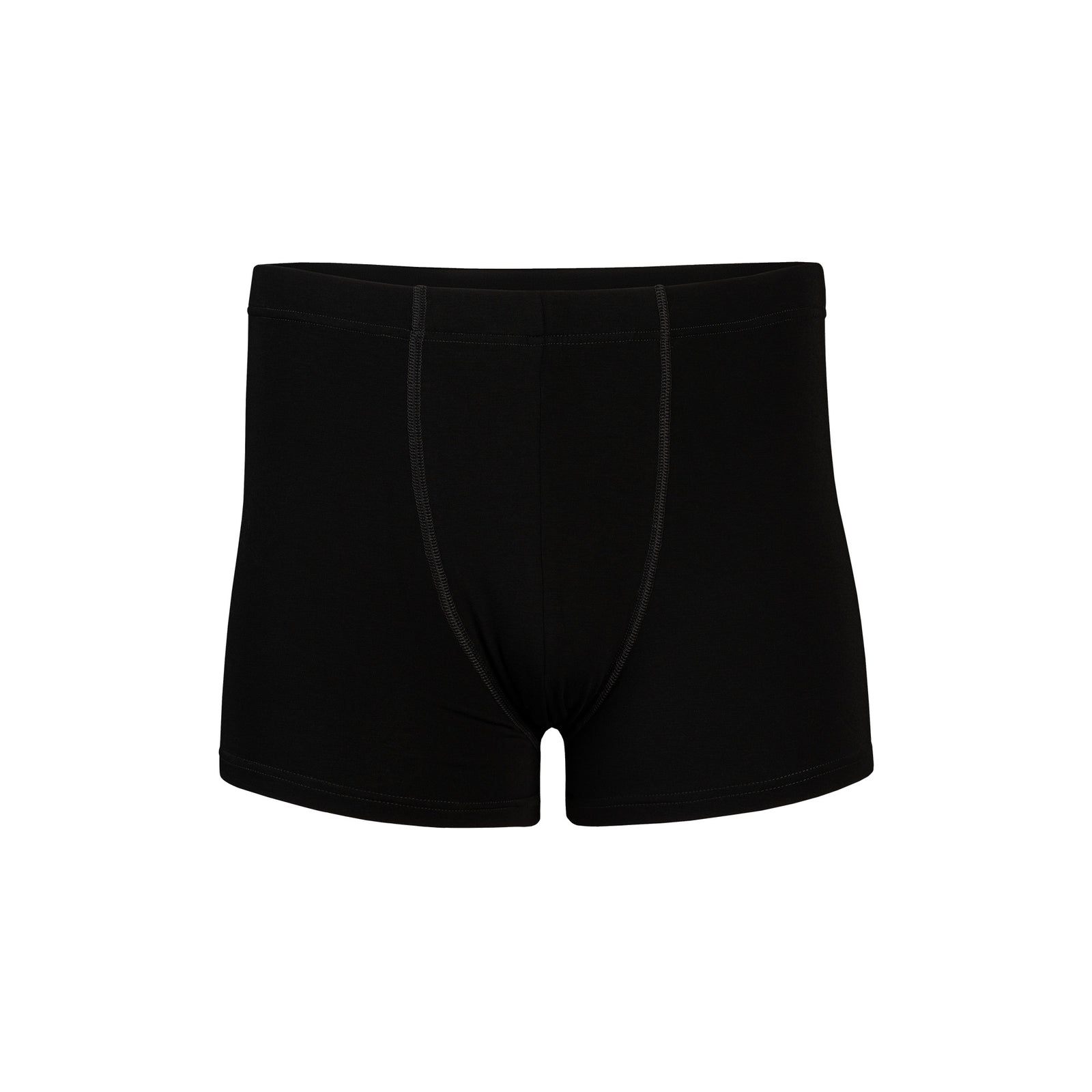Men’s black bamboo short boxer briefs worn by model, front view in a modern living room setting.