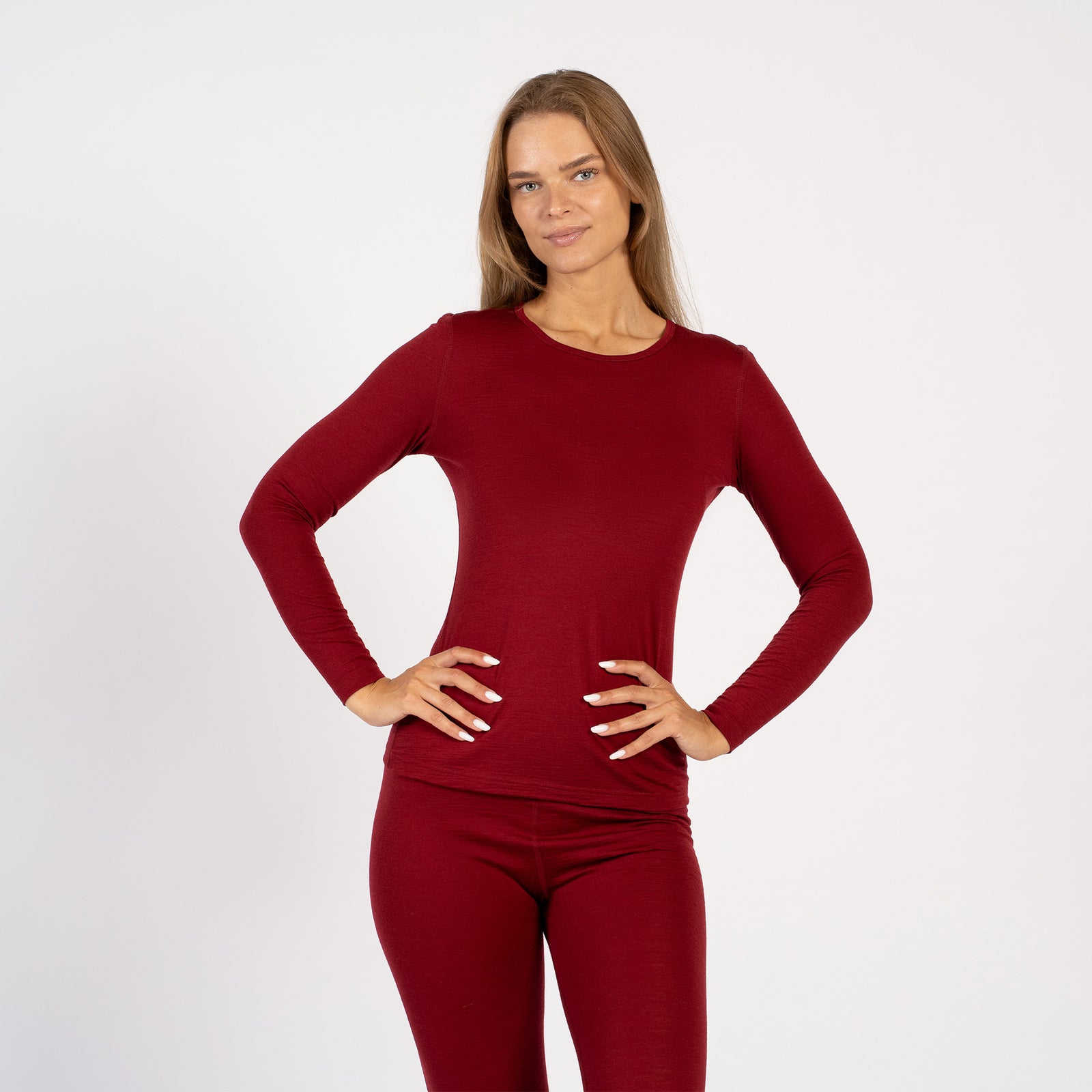 Woman wearing royal cherry Merino wool thermal long sleeve – front view