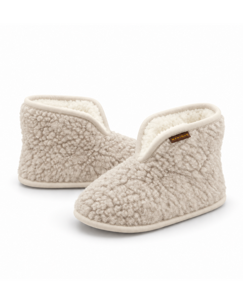A pair of beige, textured fleece women's booties with the collars turned up to ankle height, featuring a front slit design and a small brown "MENIQUE" brand tag on the side, displayed against a plain white background.