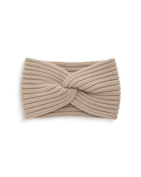 A sand beige ribbed knit headband featuring a twisted knot design in the center, displayed flat against a plain white background.